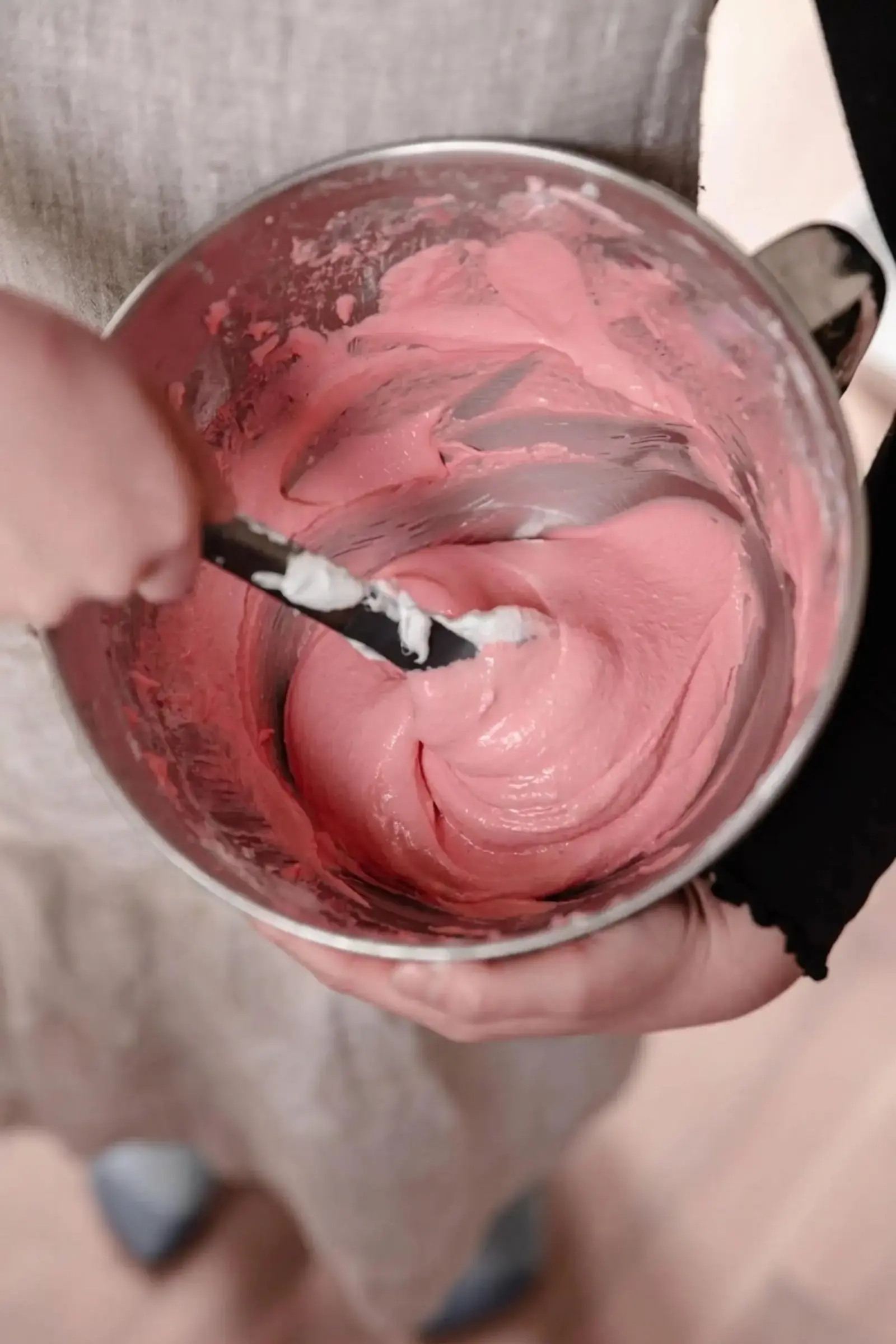 Foolproof Macaron Recipe, Step Six: Using a rubber spatula, scrape down the bowl and gently fold the batter from the outside of the bowl and gently twisting it into the center in a circle like manner