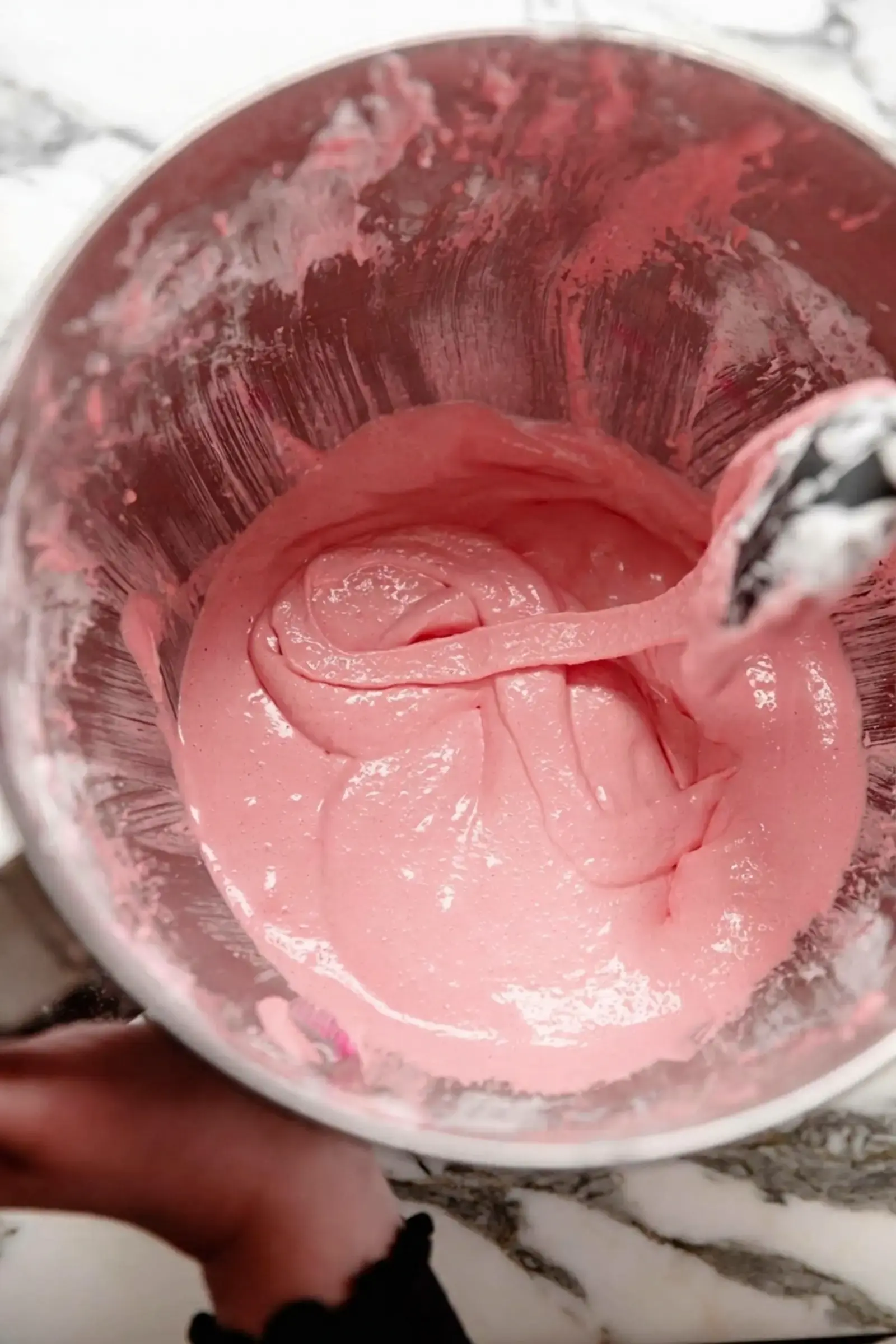 Foolproof Macaron Recipe, Step Six: Using a rubber spatula, scrape down the bowl and gently fold the batter from the outside of the bowl and gently twisting it into the center in a circle like manner